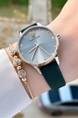 Daniel Klein DKISTE1332 Kasası Gold Gümüş Kordonu Yeşil Renk Hediye Paketli Kadın Kol Saati ve Bileklik - 1