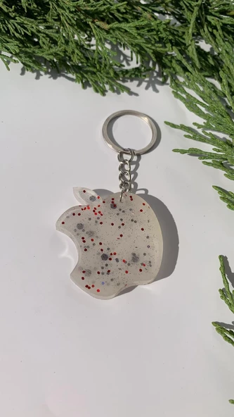 Sedefli Beyaz İçinde Siyah Kırmızı Glitterli Apple Elma Şekil Gümüş Aksesuarlı Anahtarlık El Yapımı ürün görseli