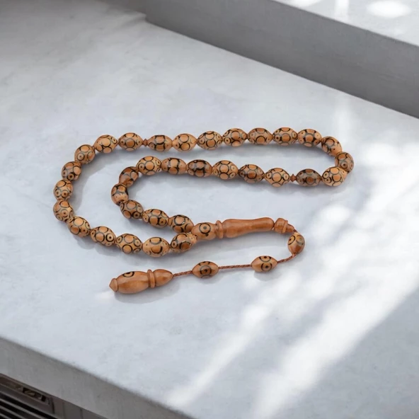 Lazer İşlemeli Sistem Püsküllü 12x9 mm Arpa Kesim Kuka Tesbih ürün görseli 1