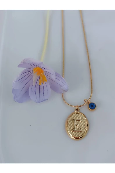 paslanmaz çelik şık ve tarz altın görünümlü nazar boncuklu E harfli kolye ürün görseli 1