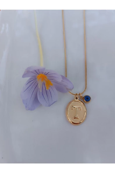 paslanmaz çelik şık ve tarz altın görünümlü nazar boncuklu T harfli kolye ürün görseli 1