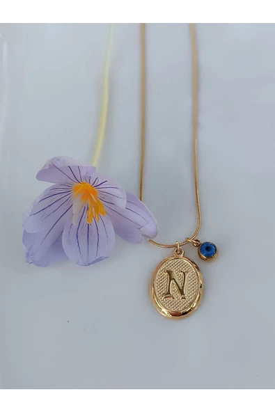 paslanmaz çelik şık ve tarz altın görünümlü nazar boncuklu N harfli kolye ürün görseli 1