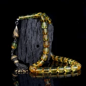 HER TANESİ SİNEK FOSİLLİ GÜMÜŞ PÜSKÜLLÜ KAPSÜL KESİM DAMLA KEHRİBAR TESBİH thumbnail 1