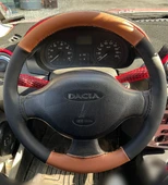 DİKİŞLİ DİREKSİYON KILIFI TABA DERİ SİYAH DERİ SİYAH DİKİŞLİ DACİA FOTOĞRAFTAKİ DİREKSİYON thumbnail 1