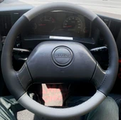 DİKİŞLİ DİREKSİYON KILIFI GRİ DERİ SİYAH DERİ SİYAH DİKİŞLİ ISUZU NPR İCİN thumbnail 1