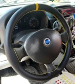 DİKİŞLİ DİREKSİYON KILIFI SİYAH DERİ SARI YÜZÜK SARI DİKİŞLİ FIAT DOBLO İÇİN (FOTODAKİ DİREKSİYON) thumbnail 1