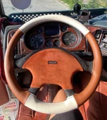 DİKİŞLİ DİREKSİYON KILIFI TABA DERİ KREM DERİ SİYAH DİKİŞLİ TIR KAMYON DAF XF İÇİN thumbnail 1