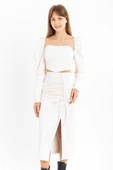 Deri Kumaş Diz Altı Boy Yırtmaçlı Büzgü Detaylı Kadın Etek-Ekru thumbnail 1