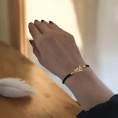 Harfe Özel 14 Ayar Altın Plakalı Kuş Motifli Siyah İpek Örgülü Hediye Bileklik-360 thumbnail 1