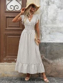 Kadın Kısa Kelebek Kollu Kruvaze Yakalı Desenli Süprem Elbise thumbnail 4