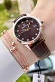 Daniel Klein DKISTE1149 Takvimli Kasası Rose Kordonu Kahverengi Renk Hediye Paketli Kadın Kol Saati ve Bileklik thumbnail 1