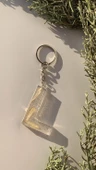 L Harfi Şeffaf Epoksi Simli Kurutulmuş Papatya Yapraklı Gümüş Aksesuarlı Anahtarlık El Yapımı thumbnail 1