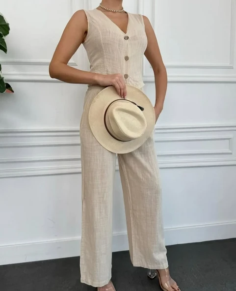 Kadın bol paça kesimi sayesinde hareket özgürlüğü tanıyan keten pantolon - 3