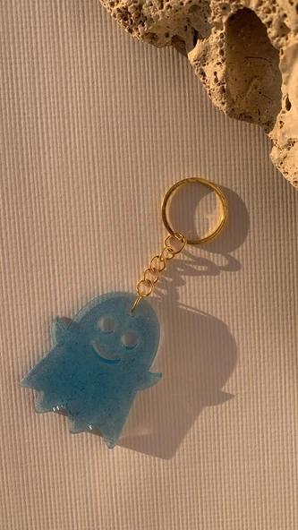Turkuaz Mavi Renkli Gold Aksesuarlı Hayalet Şekil Anahtarlık El Yapımı Epoksi Hediyelik ürün görseli