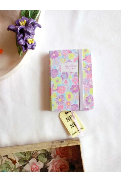 NOT ANI HEDİYE KIZ ÇOCUK GENÇ ÇİZGİLİ DEFTER 80 YAPRAK A7 CEP BOY DESENLİ LASTİK KAPAMA MOR ürün görseli