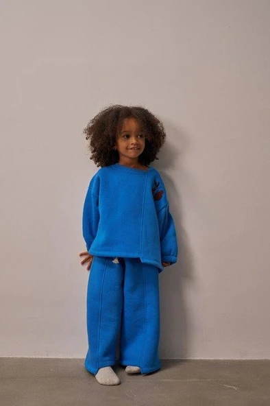 Mavi Omuz Nakışlı Asimetrik Detaylı Alt Üst Takım ürün görseli