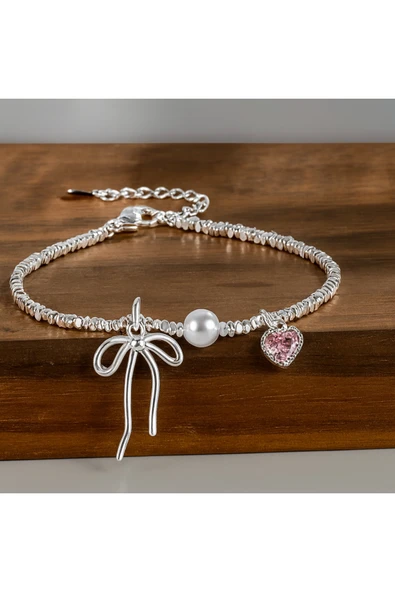 925 Ayar Gümüş Kadın Bileklik Fiyonk Figürlü İnci ve Kalp Taşlı Zarif Tasarım ürün görseli 1