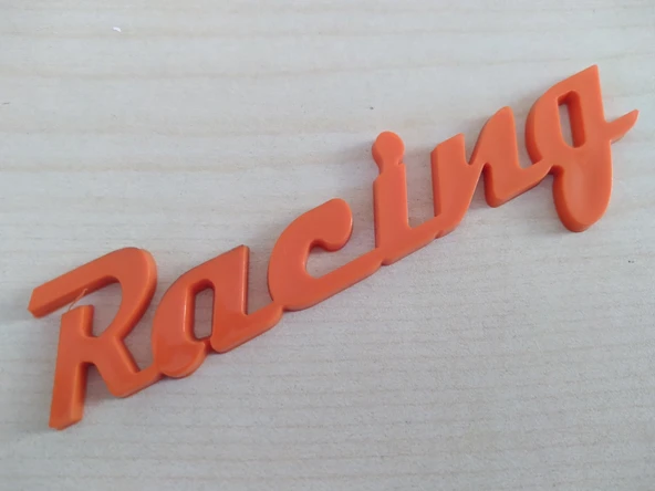 RACİNG LOGOSU 10,5x2cm KABARTMA SPORT ARMA TURUNCU (RACİNG ARMASI) RACİNG YAZISI ürün görseli 1