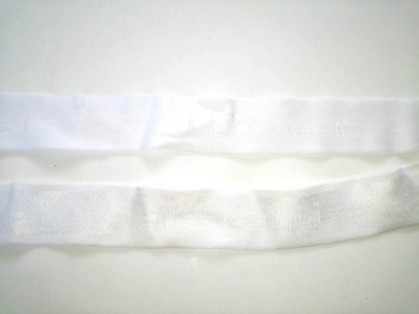 Lastik beyaz yazılı desenli  3,5Cm  5Mt Şort,Paça,kol Ve Don Lastiğidir 1 Paket 5Mt - 3