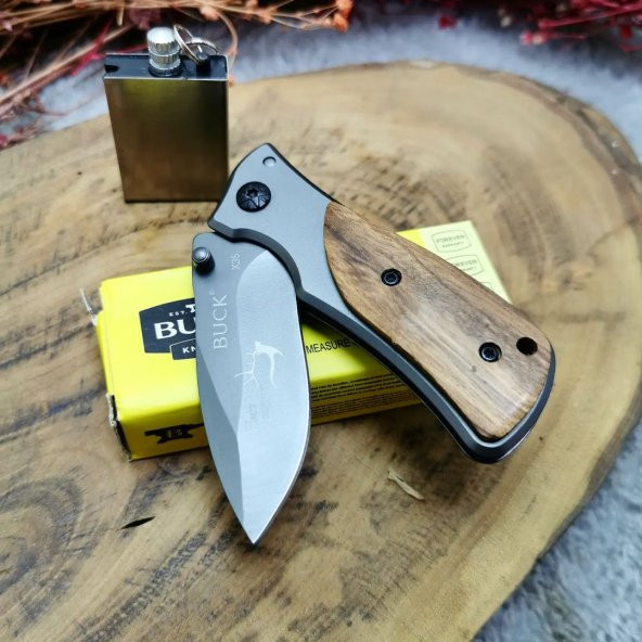 15 cm buck marka çelik manuel ahşap kabze dizayn yanında zippo kibrit ile birlikte