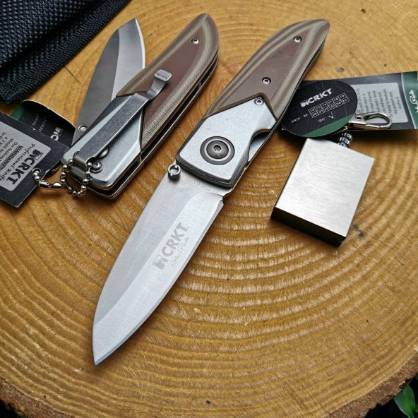 18 cm crkt marka kılıflı manuel çelik bıçak yanında zippo kibrit ile birlikte