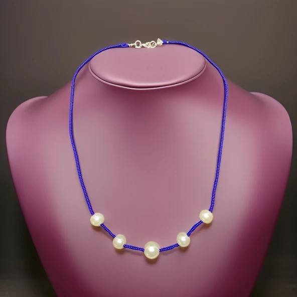 Gökyüzünün Büyülü Parçası: Beyaz İnci ve Mavi Taşlı Kolye! ürün görseli 1