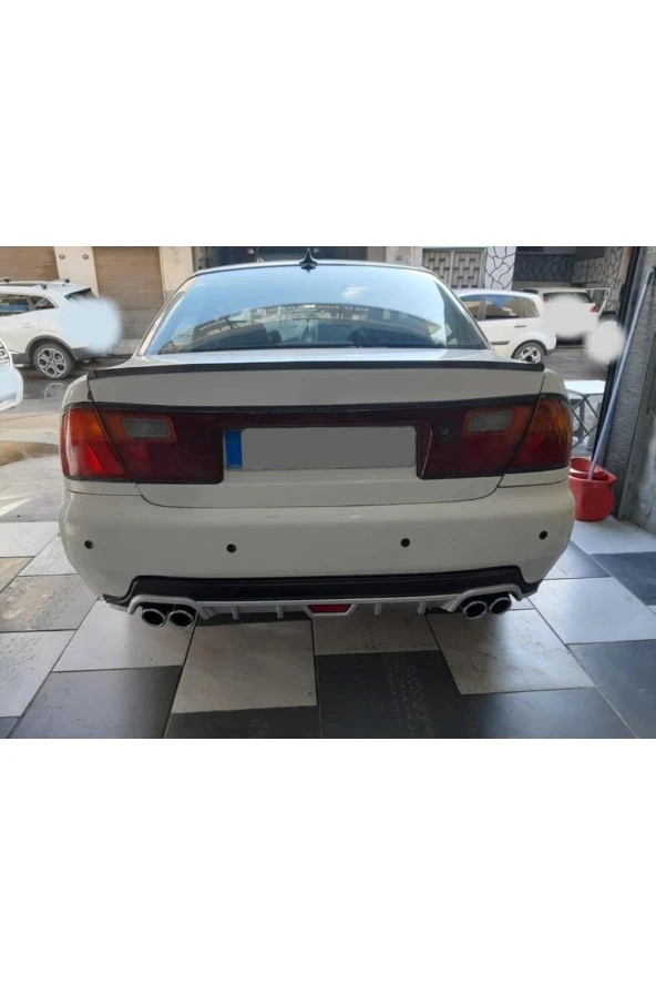 OTO H.İ.T.  MAZDA 323 95-99 UYUMLU BODY KİT DİFÜZÖR 4 ÇIKIŞ YUVARLAK GRİ MODEL 1 ürün görseli